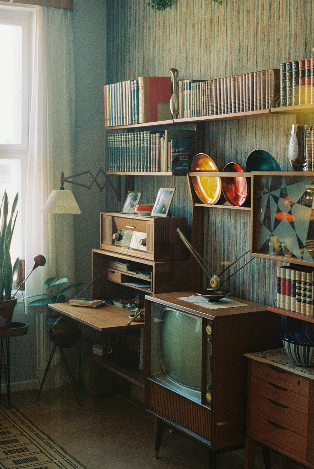 Retro 1980s decor with patterned wallpaper and vintage furniture