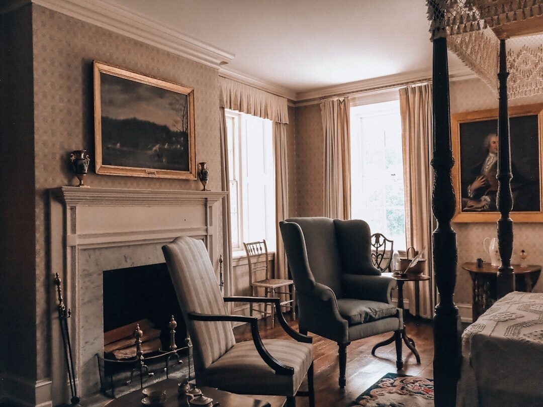 Elegant vintage living room with 1980s decor, velvet armchairs and brass details