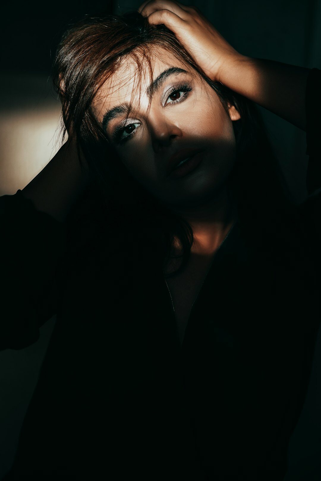 Studio portrait of a European woman in her late twenties, interior photographer
