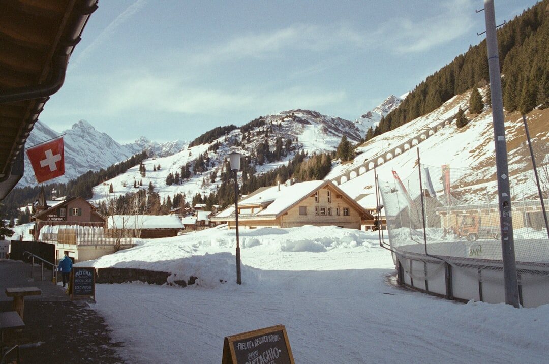 Traditional Swiss wooden chalet exterior in the snow-covered mountains