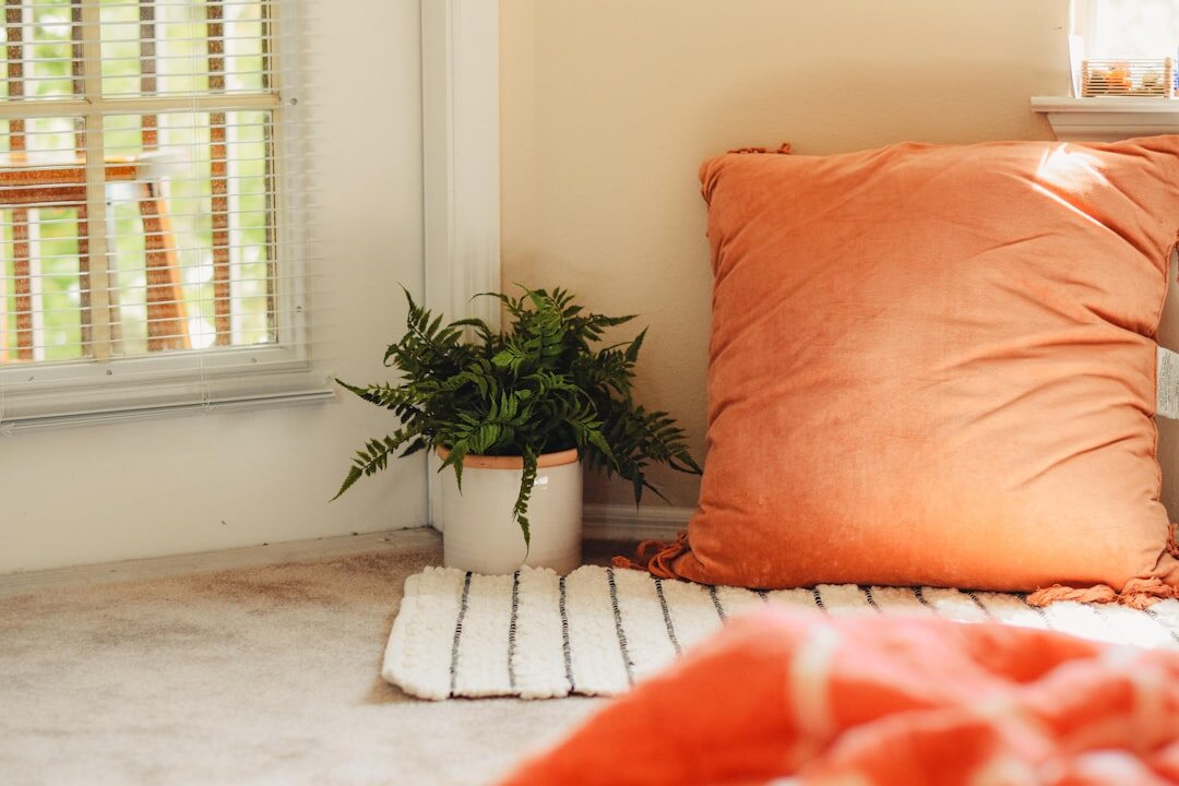 Cozy reading nook styled with warm textiles and soft lighting